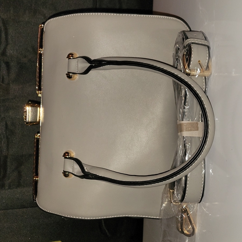 Beautiful Grey and gold barrel style purse comes with shoulder strap